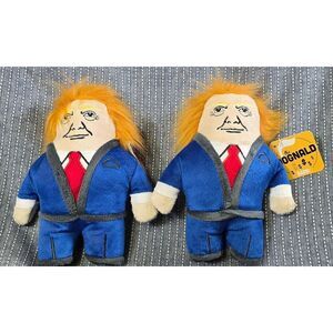 Two "The Dognald" Dog Toys